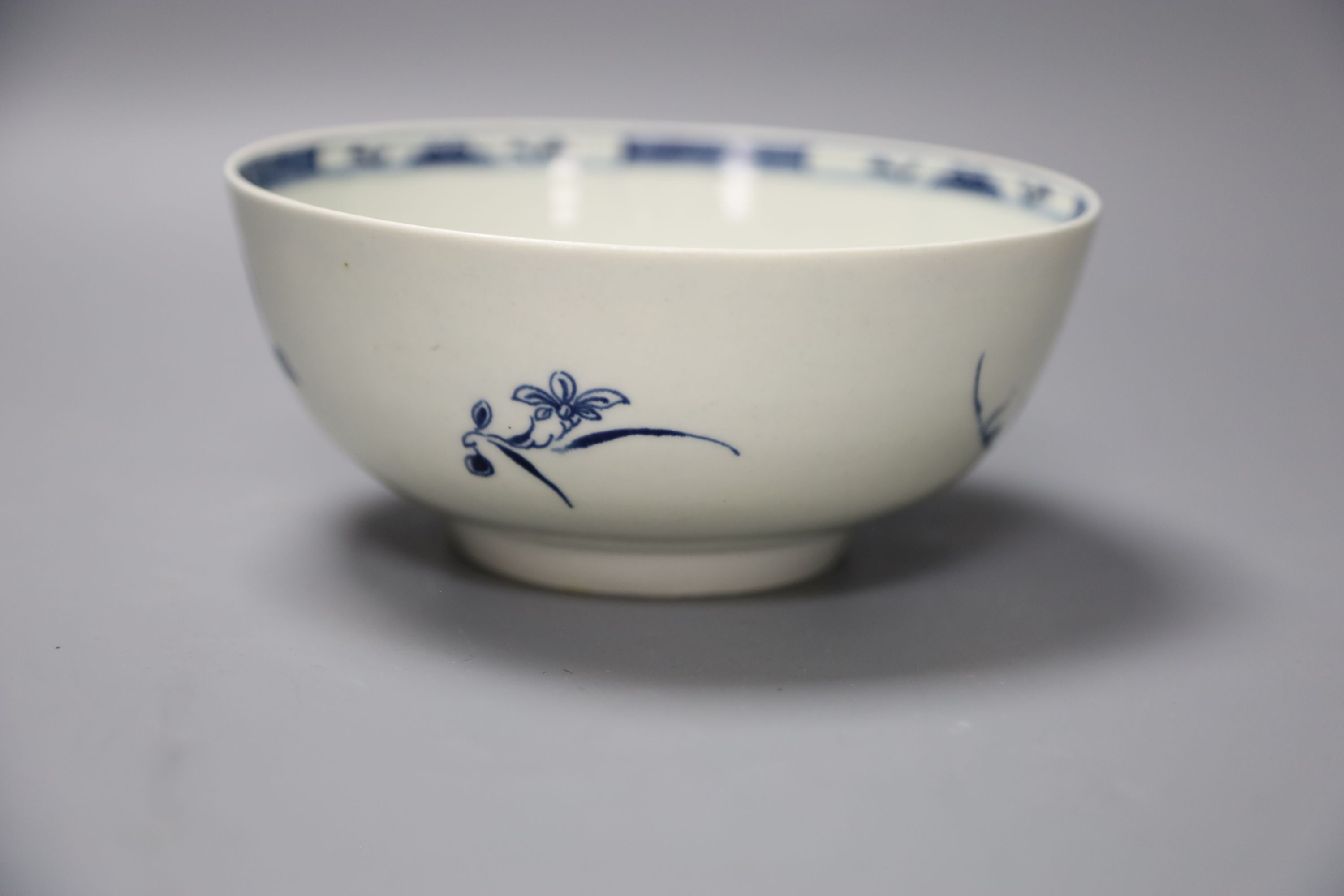 An 18th century Worcester bowl painted with the Candle fence pattern, early crescent mark, diameter 16cm